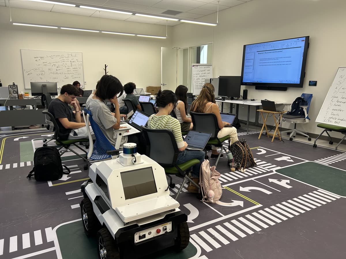 Students planning on laptops in the Vehicle Computing Lab